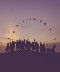 silhouette of people standing together on a hill